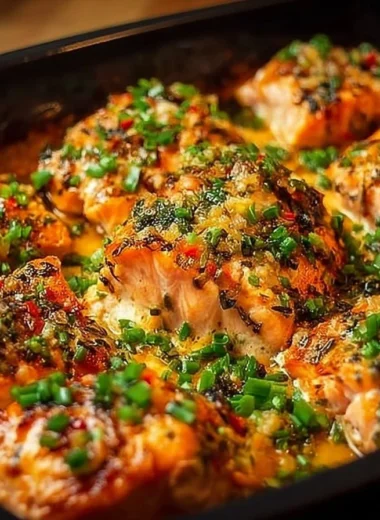 Delicious Bang Bang Salmon recipe served on a plate with garnishes.