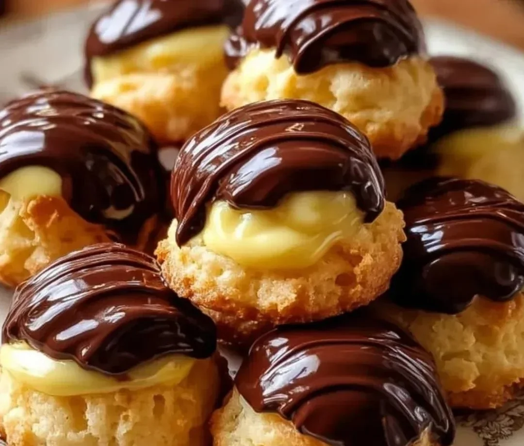 Boston Cream Pie Cookie Bites with chocolate and creamy filling on a plate