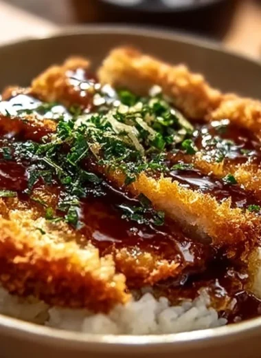 Crispy Japanese Katsu Bowls garnished with fresh vegetables and sauce