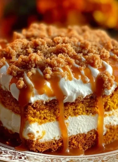 Delicious slice of Pumpkin Better Than Sex Cake with creamy frosting