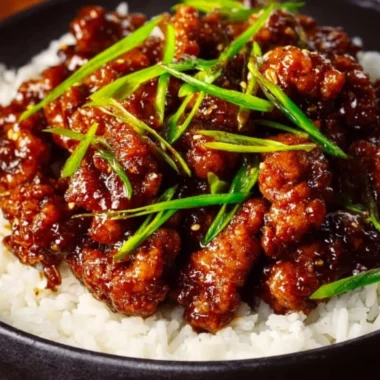 Spicy Dragon Chicken dish garnished with fresh herbs