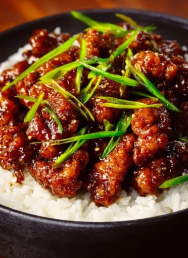 Spicy Dragon Chicken dish garnished with fresh herbs