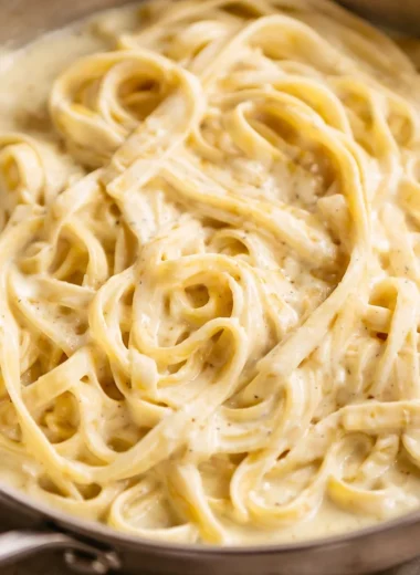 Delicious homemade alfredo sauce served over fettuccine pasta.