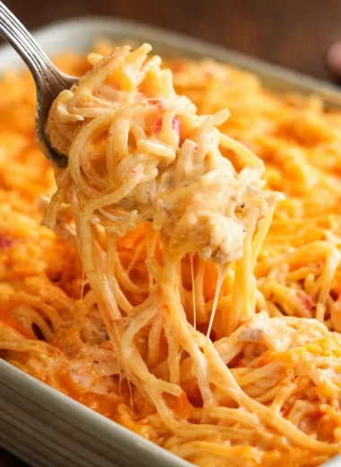 Delicious creamy chicken spaghetti served in a bowl with fresh herbs