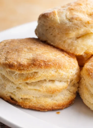 Fluffy homemade country biscuits fresh out of the oven, perfect for breakfast.