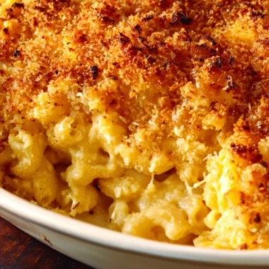 Homemade baked mac and cheese with golden crust and creamy cheese sauce