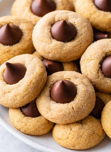 Delicious peanut butter blossoms cookies topped with Hershey's kisses.