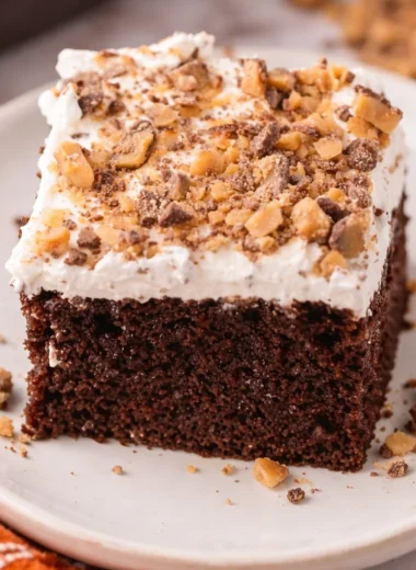 Delicious Better Than Sex Cake with chocolate, caramel sauce, and whipped topping.