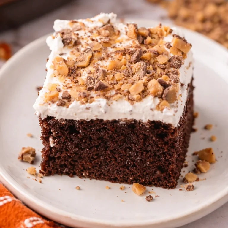 Delicious Better Than Sex Cake with chocolate, caramel sauce, and whipped topping.