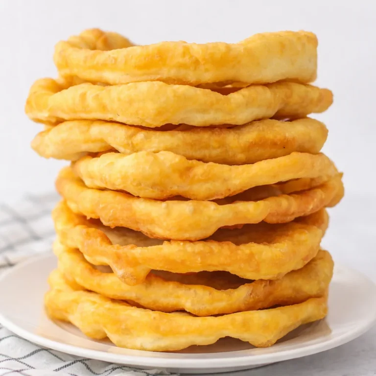 Homemade fry bread served with toppings, showcasing its golden, fluffy texture.