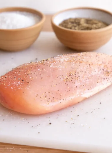 Perfectly cooked chicken breasts on a skillet, showcasing juicy, tender texture.