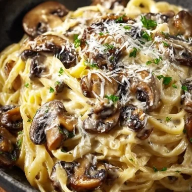 Creamy mushroom gruyere pasta in a bowl, garnished with herbs