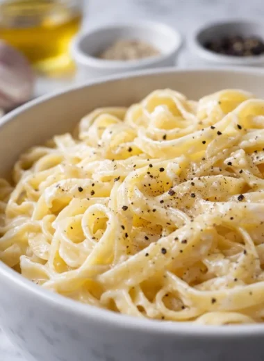 Creamy pasta made without heavy cream, featuring healthy and flavorful ingredients.