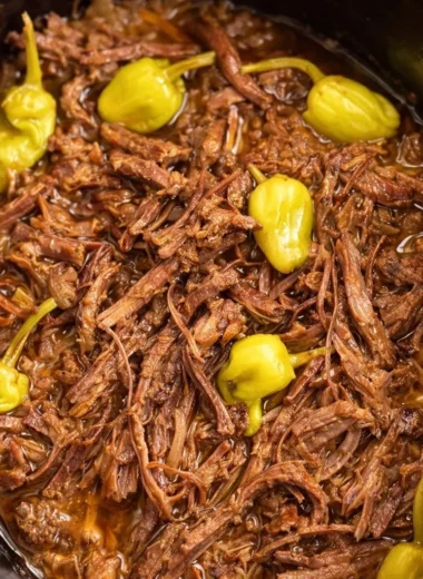 Delicious Mississippi Pot Roast served with vegetables and herbs