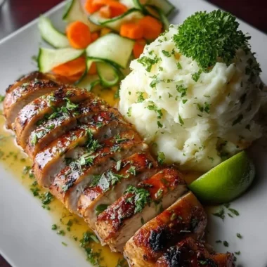 Creamy garlic herb chicken plated with fluffy mashed potatoes