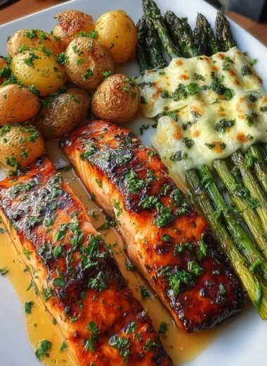 Crispy garlic butter salmon served with roasted potatoes and asparagus