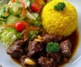 Garlic Beef Bites with Yellow Rice & Garden Salad