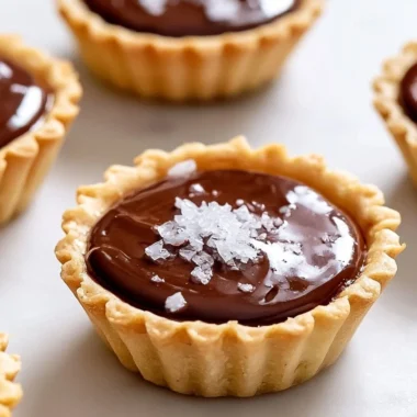 Delicious creamy French chocolate tartlets on a dessert plate.