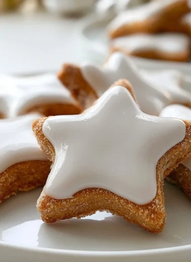 Delicious crispy cinnamon star cookies arranged on a festive platter.