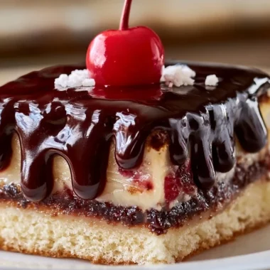 Decadent Donauwelle cake with chocolate, cherries, and cream layers