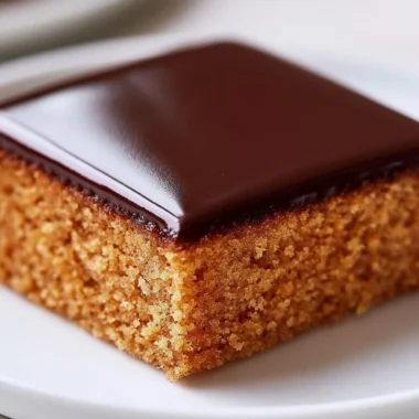 Delicious slice of fragrant German honey cake with honey drizzled on top