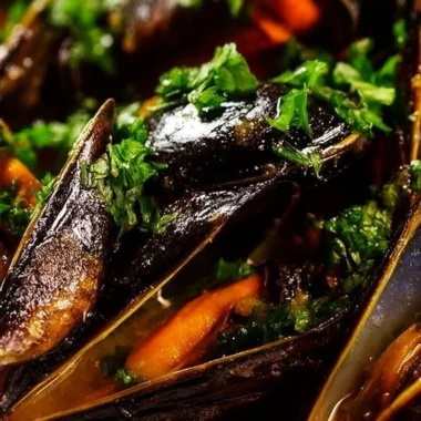 Delicious fresh mussels in a white wine sauce served in a bowl.