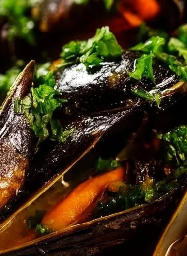 Delicious fresh mussels in a white wine sauce served in a bowl.