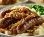 Juicy Bratwurst With Onion Sauce And Mashed Potatoes