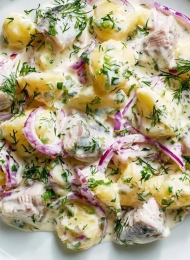 Matjesfilet Hausfrauenart dish showcasing tender herring in a savory sauce