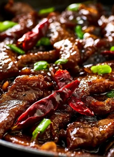 Delicious Mongolian Beef served with vegetables in a bowl.