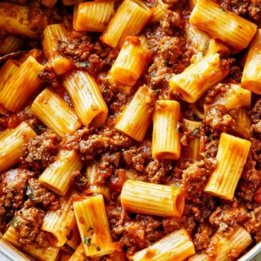 One-Pot Ground Beef Pasta in Tomato Sauce served in a bowl with herbs