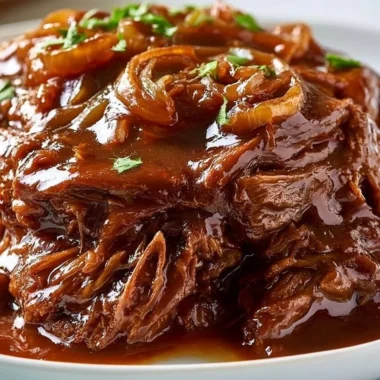 Tender slow cooker pot roast served with vegetables and gravy